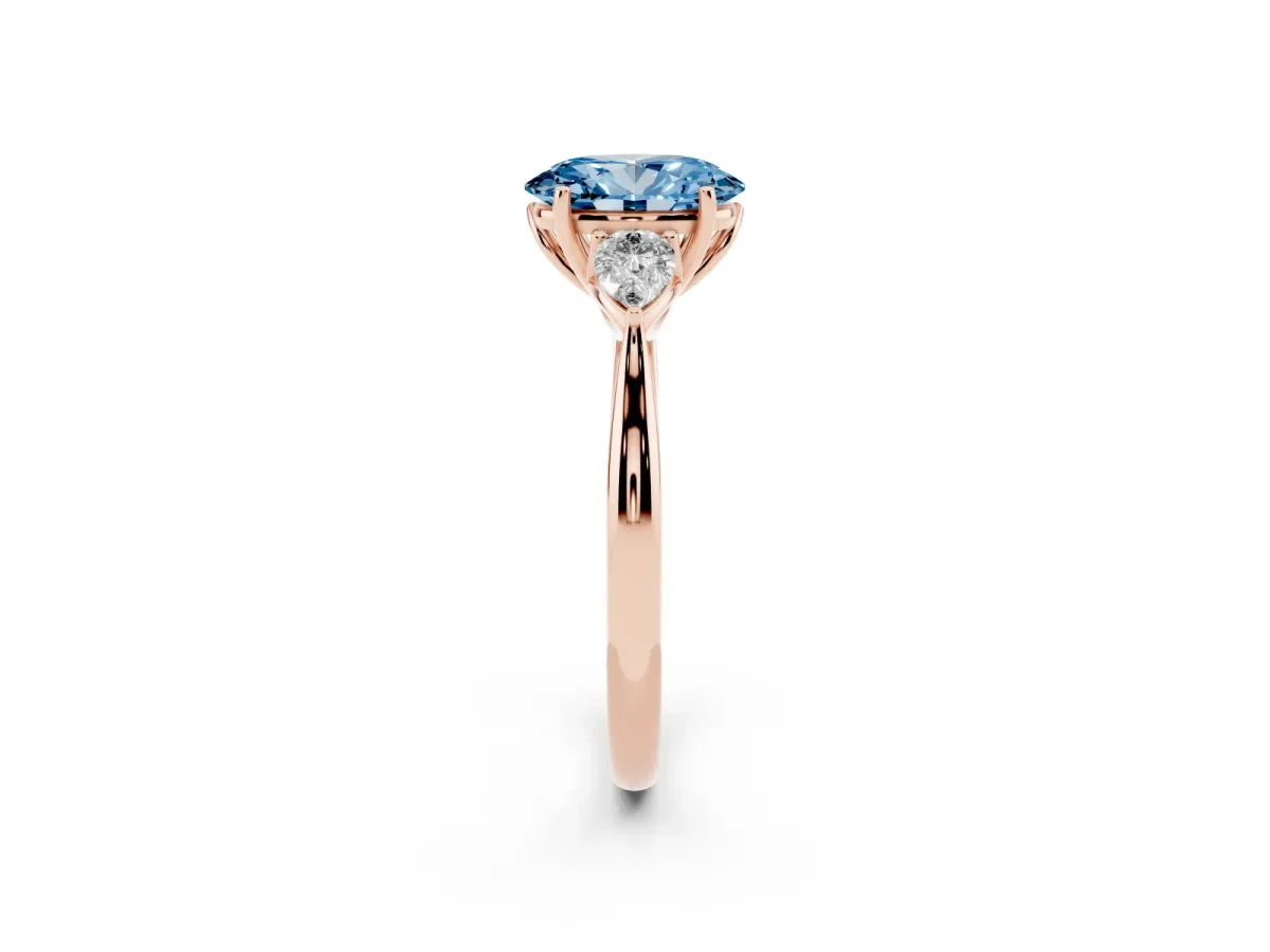 Fancy Blue Oval Cut Diamond Three-Stone Ring with Pear Side Stones and Prong Setting Rose gold