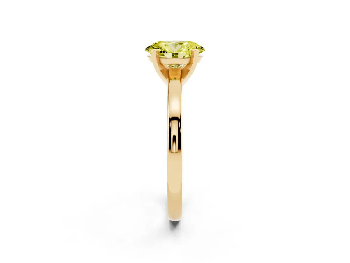 Fancy Yellow Oval Cut Solitaire Diamond Engagement Ring with Four-Prong Setting on a Classic Band Yellow gold