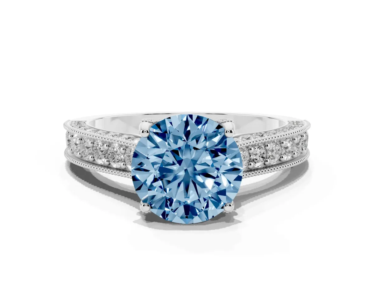 Fancy Blue Round Cut Cut Diamond Solitaire Ring with Milgrain Pave Band and Four Prong Setting Silver