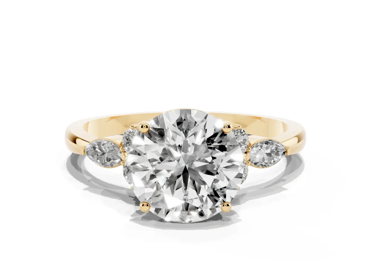 Round Cut Brilliant Diamond Solitaire Ring with Pear Side Stones and Four-Prong Setting Yellow gold