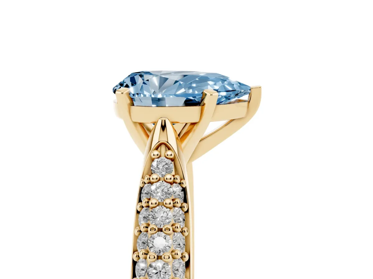 Fancy Blue Pear Cut Diamond Solitaire Engagement Ring with Multi-Row Round Pavé Band and Prong Setting Yellow gold