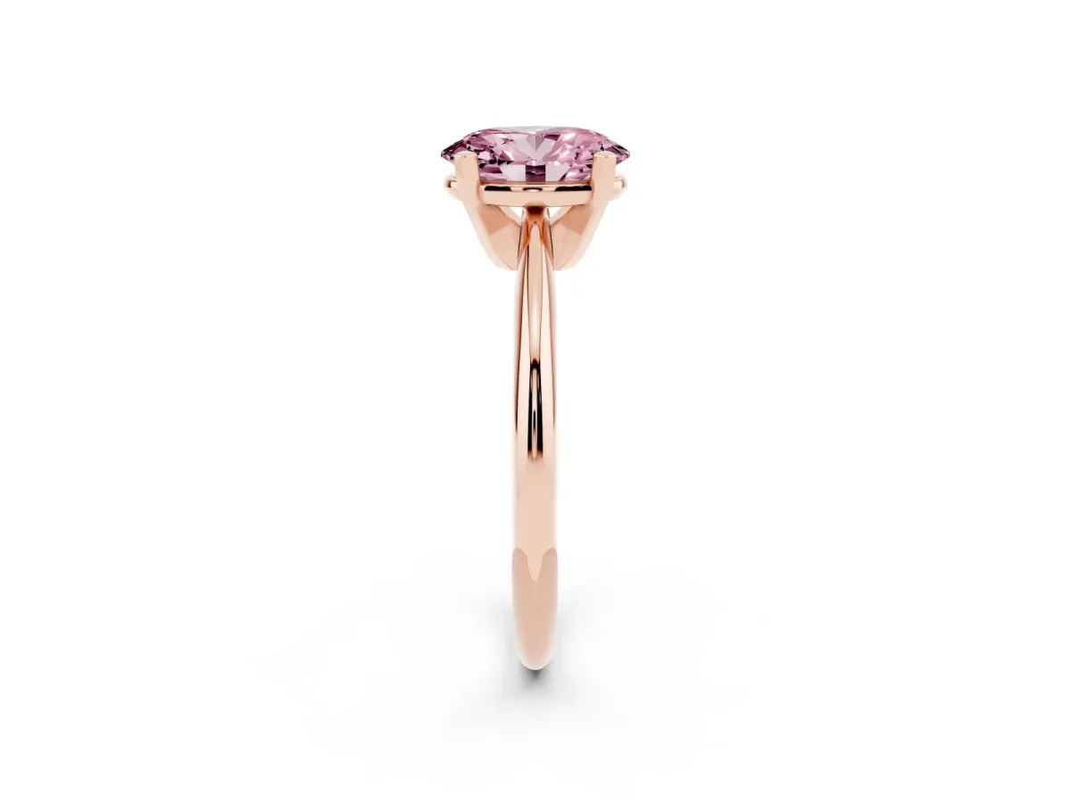 Fancy Pink Oval Cut Cut Solitaire Ring with Four-Prong Setting on a Classic Band Rose gold