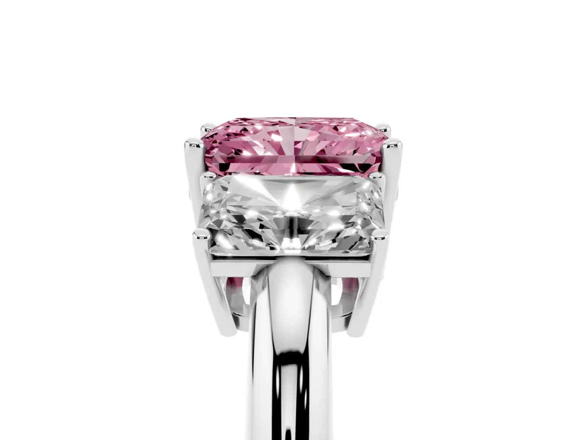 Fancy Pink Three-Stone Radiant Cut Cut Diamond Engagement Ring with Prong Setting on a White Gold Band Platinum