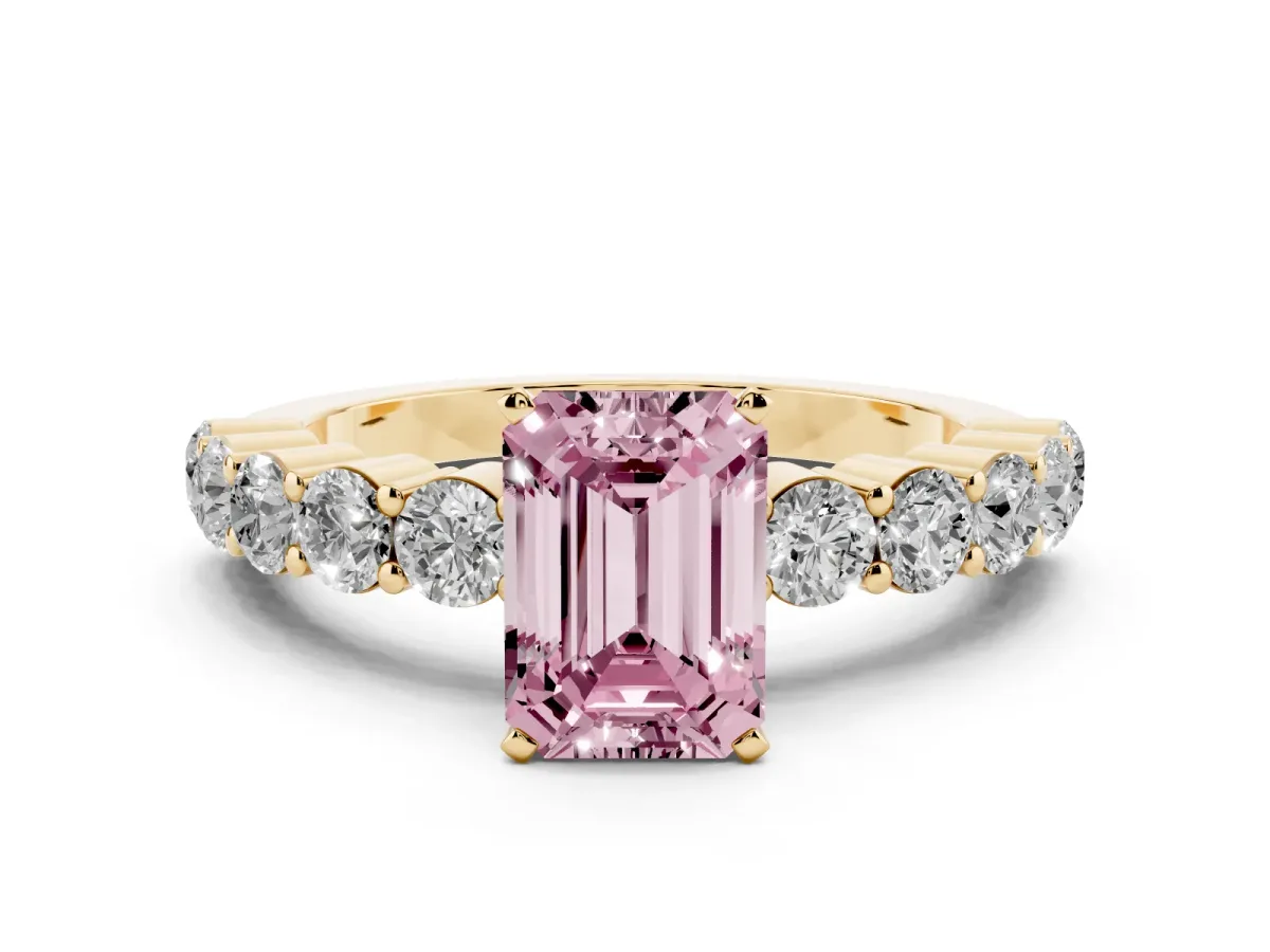 Fancy Pink Emerald Cut Diamond Solitaire Ring with Shared Prong Round Side Stones Yellow gold