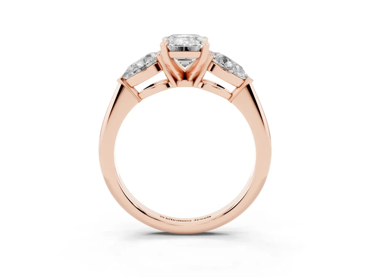 Three-Stone Emerald Cut Diamond Ring with Pear Side Stones and Four-Prong Setting Rose gold
