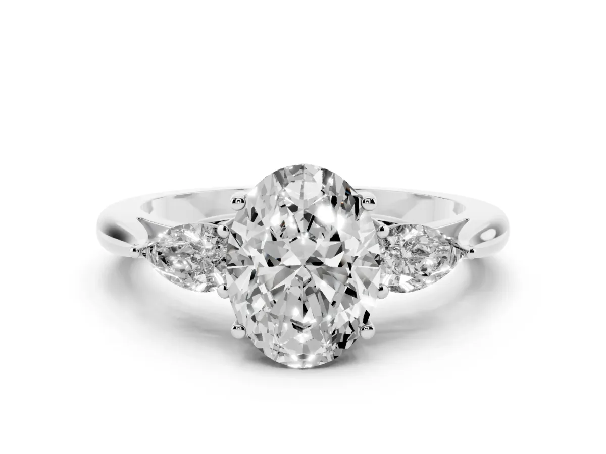 Three-Stone Oval Cut Diamond Ring with Pear Side Stones in Four-Prong Setting Platinum