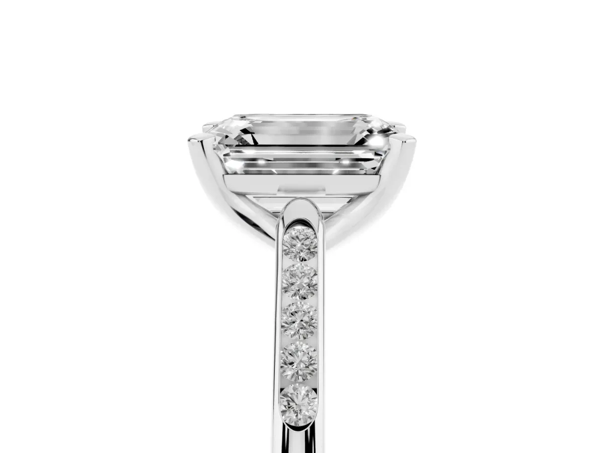 Emerald Cut Diamond Solitaire Ring with Channel Set Round Band and Prong Setting White gold