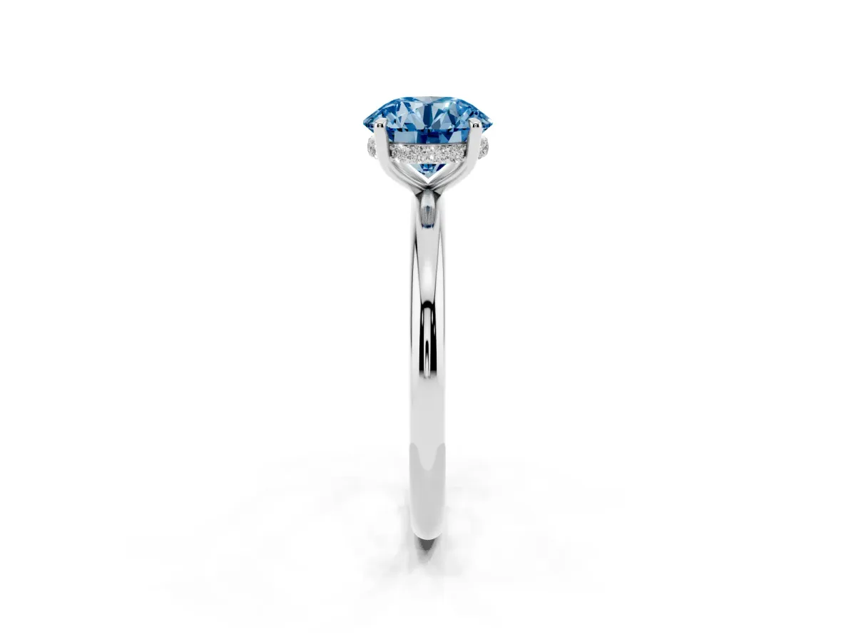 Fancy Blue Round Cut Diamond Solitaire Ring with Thin Band and Four-Prong Setting Silver