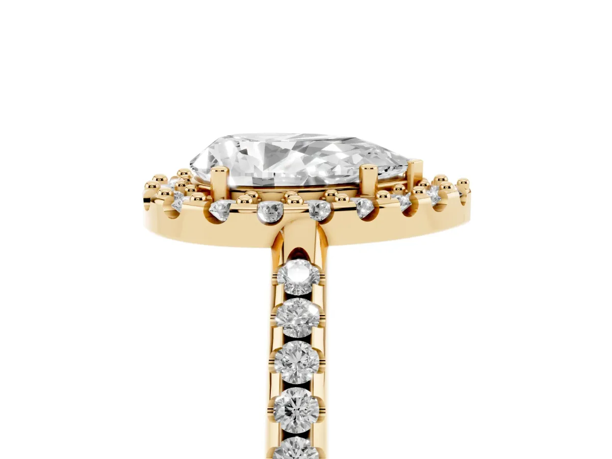 Pear Cut Diamond Pavé Halo Ring with Four-Prong Setting Yellow gold