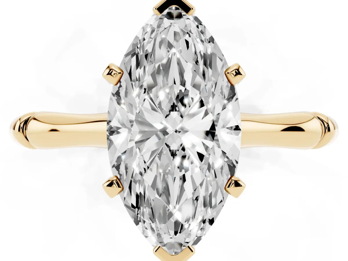 Marquise Cut Solitaire Diamond Ring with Bamboo Band and Four-Prong Setting Yellow gold