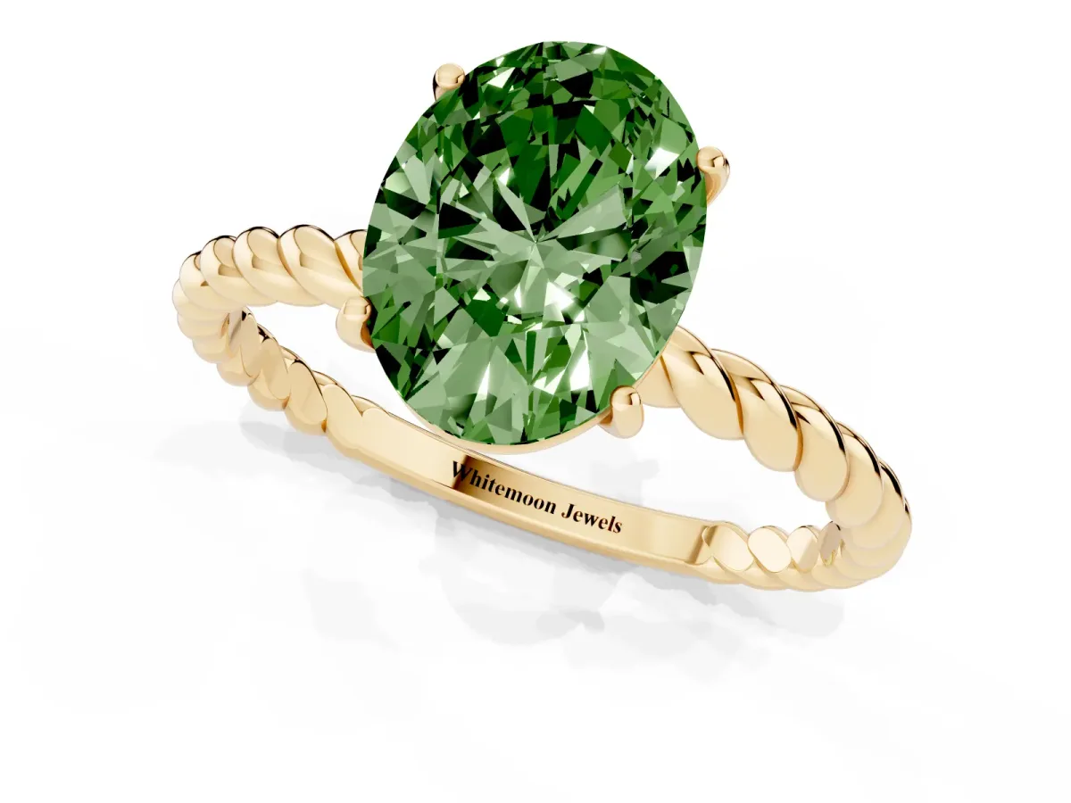 Fancy Green Oval Cut Solitaire Twist Band Ring with Four-Prong Setting Yellow gold