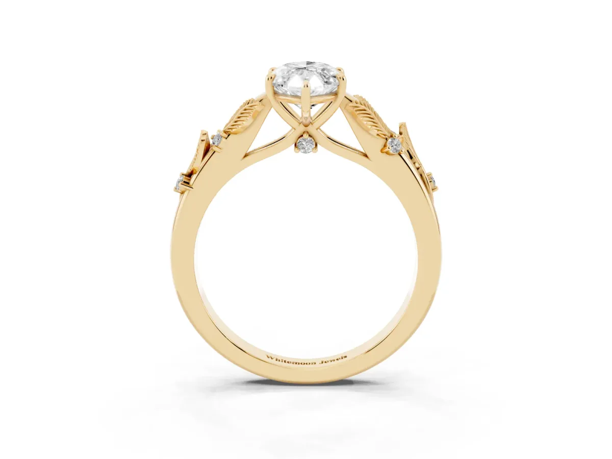 Marquise Cut Diamond Solitaire Ring with Leaf Motif Band and Four-Prong Setting Yellow gold