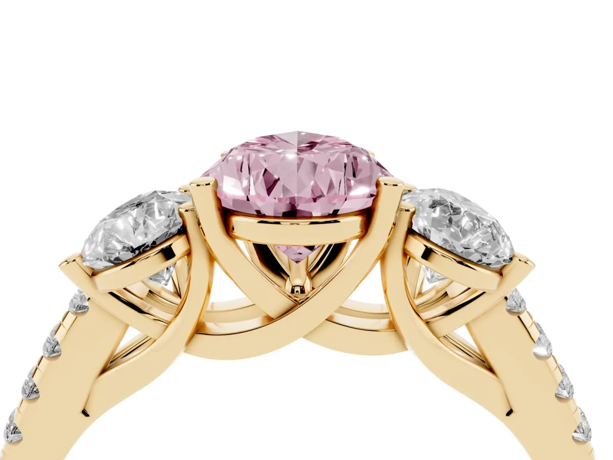 Fancy Pink Three-Stone Pear Cut Diamond Ring with Round Pavé Band and Prong Setting Yellow gold