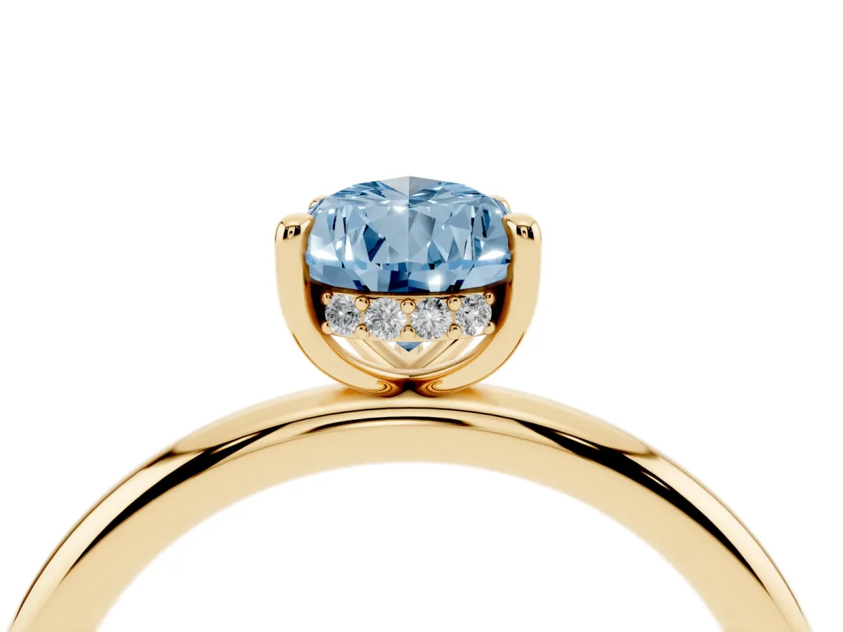Fancy Blue Pear Cut Diamond Solitaire Ring with Thin Band and Four-Prong Setting Yellow gold