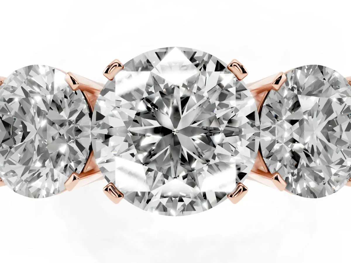 Three-Stone Round Cut Cut Diamond Ring with Channel Set Band and Four-Prong Setting Rose gold