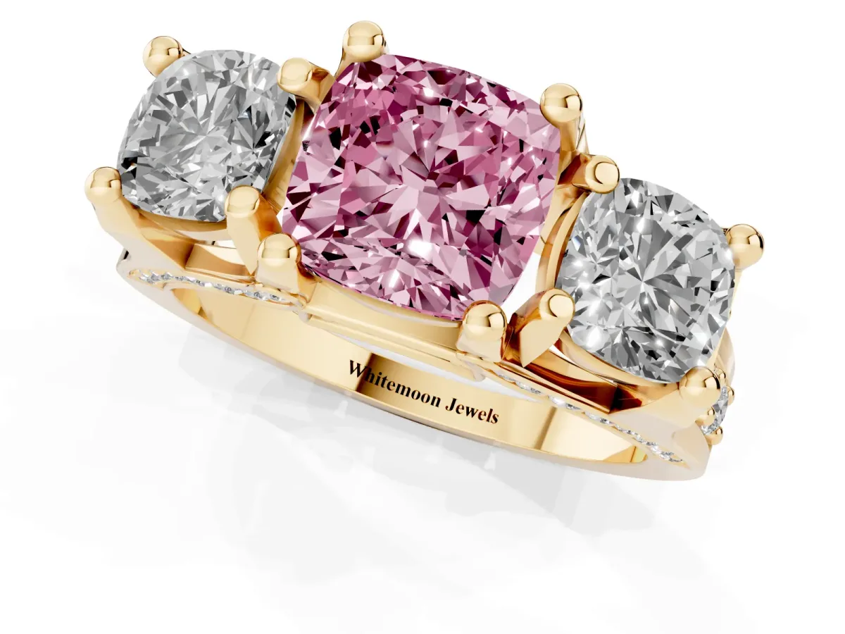 Fancy Pink Cushion Cut Diamond Three-Stone Ring with Channel Set Band and Four-Prong Setting Yellow gold