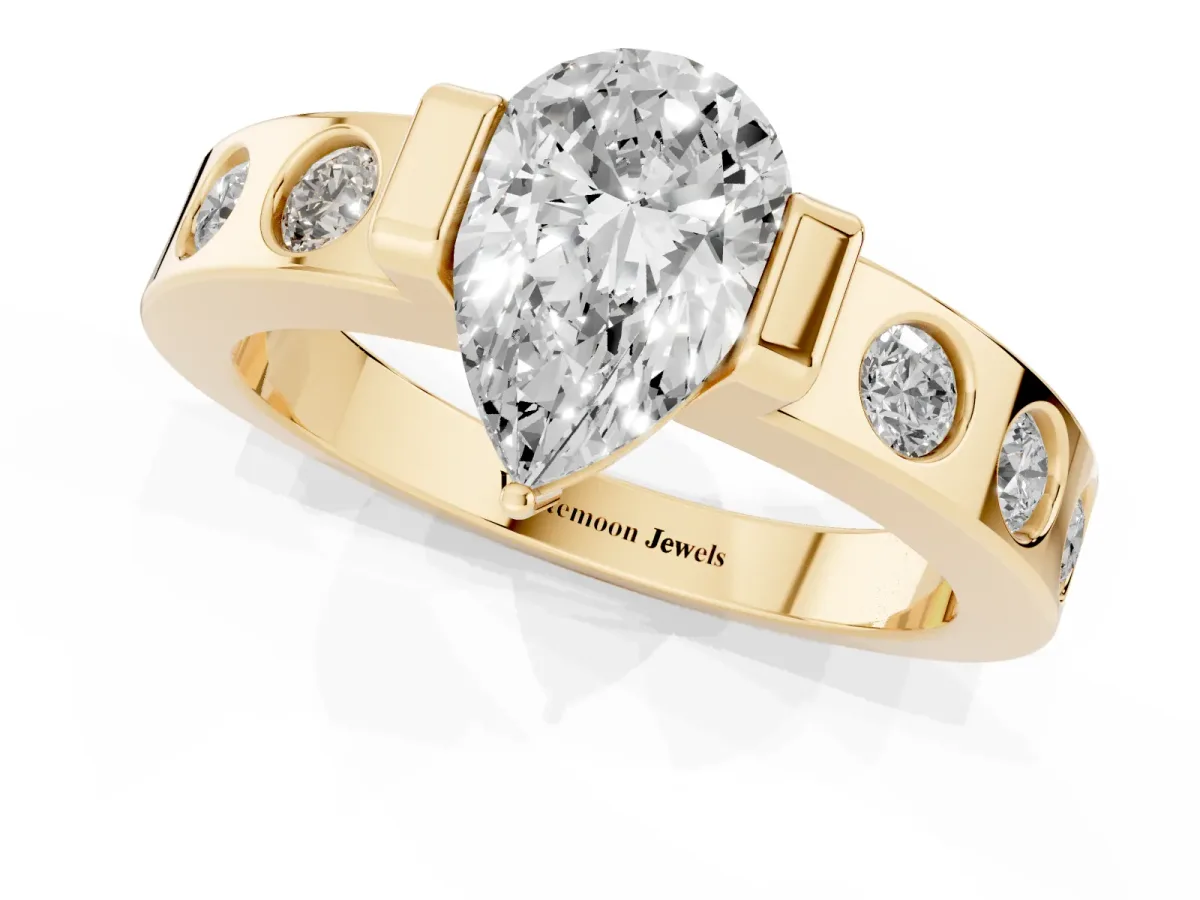 Pear Cut Brilliant Channel-Set Diamond Ring with Bezel Prong Setting Yellow gold