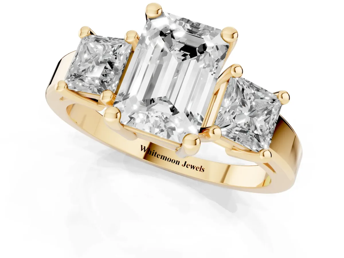 Three-Stone Emerald Cut Cut Solitaire Ring with Prong Setting Yellow gold