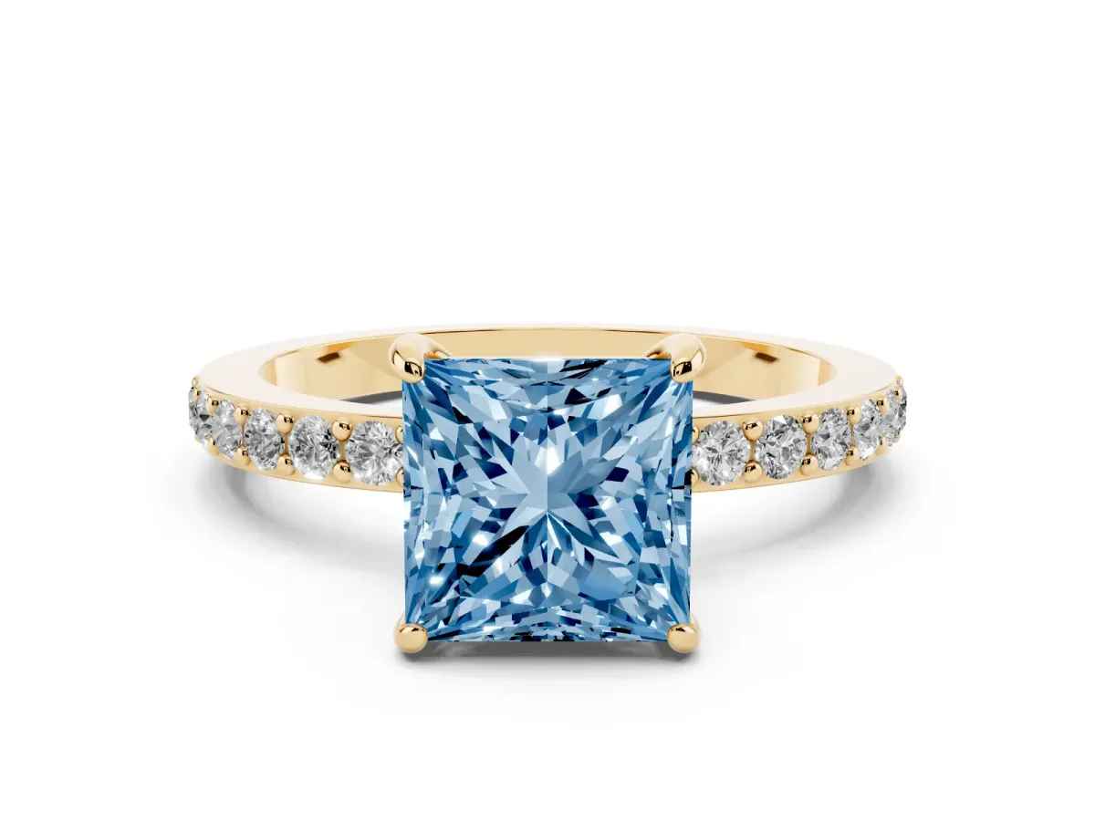 Fancy Blue Princess Cut Diamond Solitaire Engagement Ring with Pavé Band and Four-Prong Setting Yellow gold