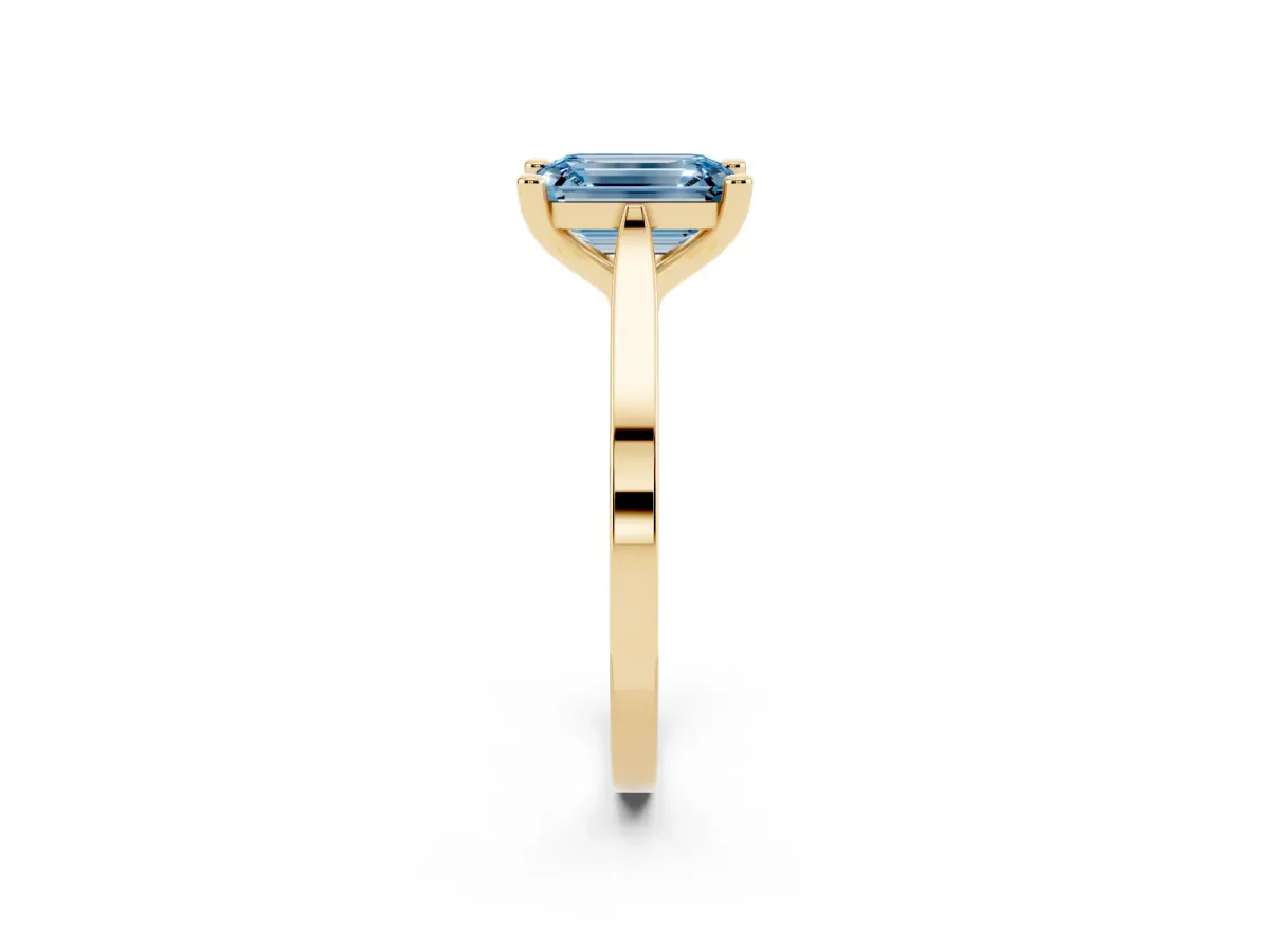 Fancy Blue Emerald Cut Solitaire Diamond Ring with Four-Prong Setting and Tapered Band Yellow gold