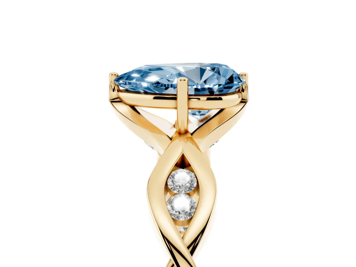 Fancy Blue Pear Cut Solitaire Twist Band with Leaf Prong Setting Yellow gold