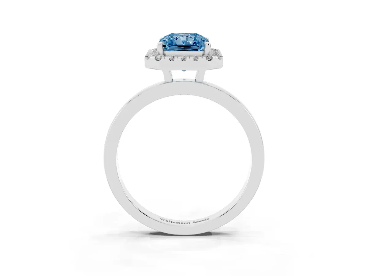 Fancy Blue Radiant Cut Halo Diamond Solitaire with Pavé Band and Four-Prong Setting White gold