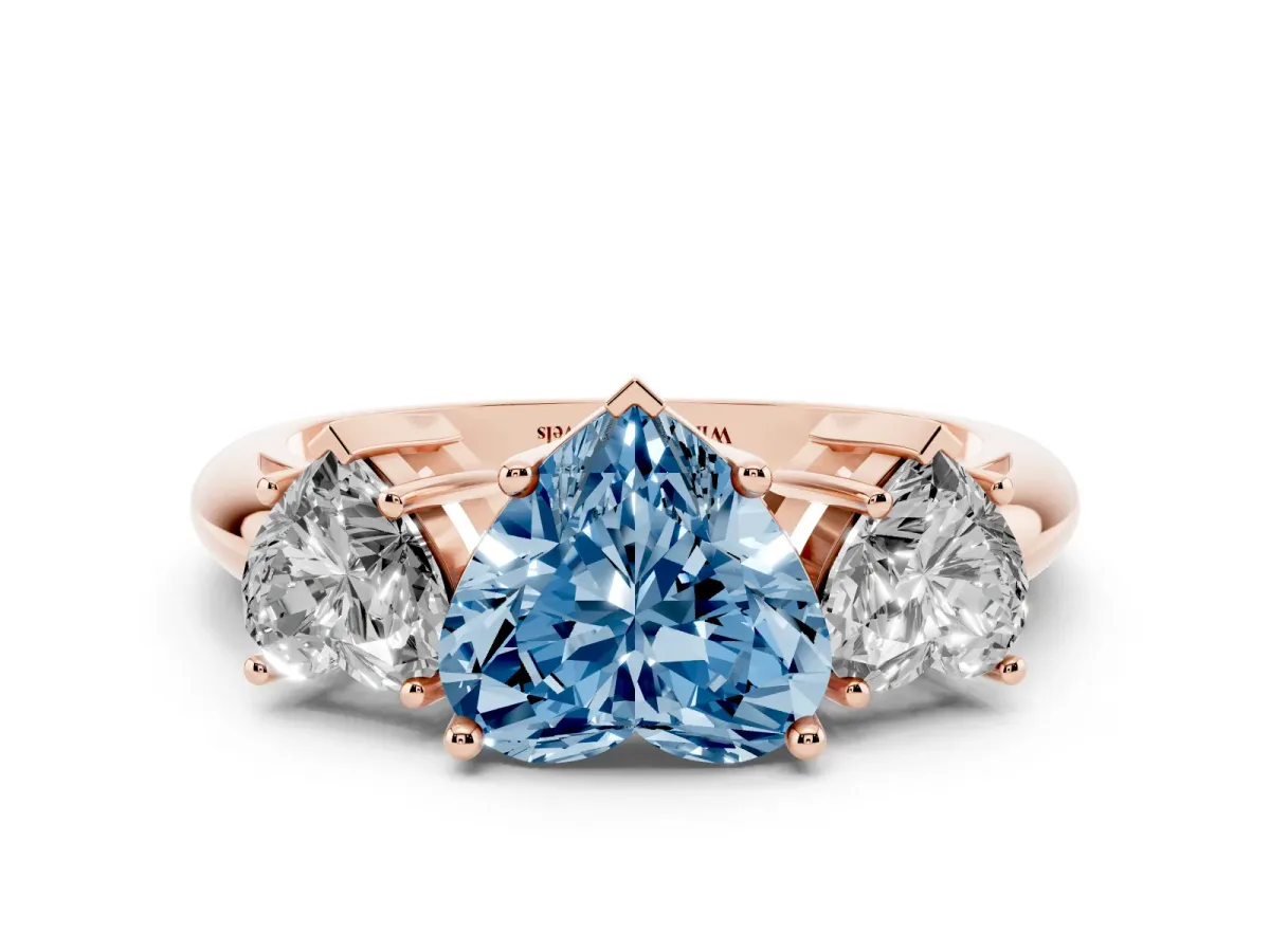 Fancy Blue Three-Stone Heart Cut Cut Diamond Engagement Ring with Prong Setting on a White Gold Band Rose gold