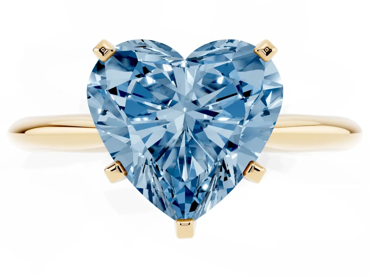 Fancy Blue Heart Cut Cut Solitaire Ring with Four-Prong Setting on a Classic Band Yellow gold