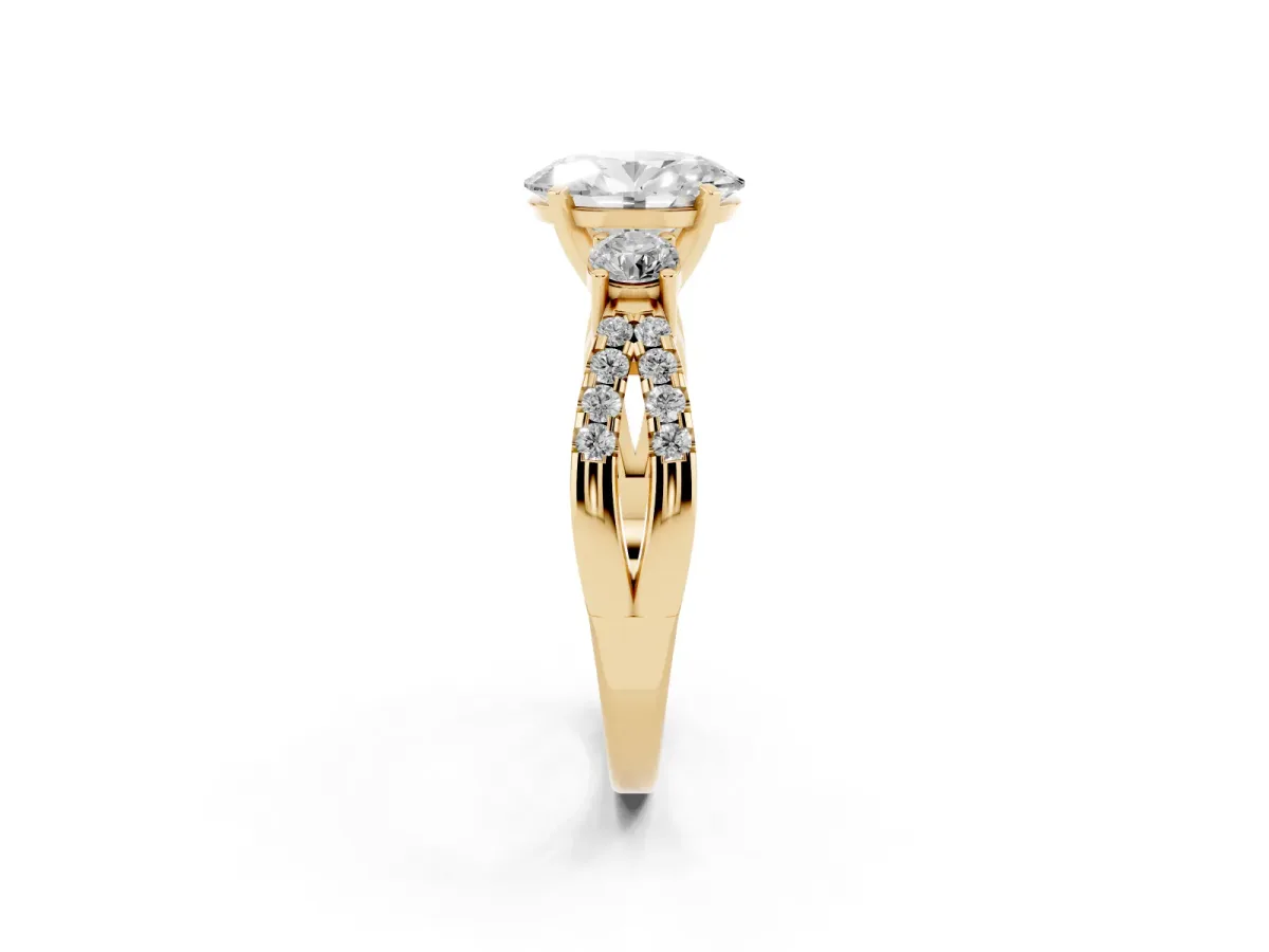 Oval Cut Diamond Three-Stone Ring with Pavé Split Shank and Four-Prong Setting Yellow gold