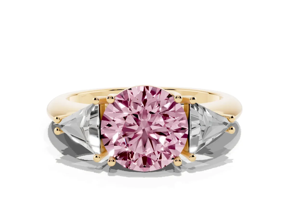 Fancy Pink Three-Stone Round Cut Diamond Engagement Ring with Trillion Side Stones and Prong Setting Yellow gold