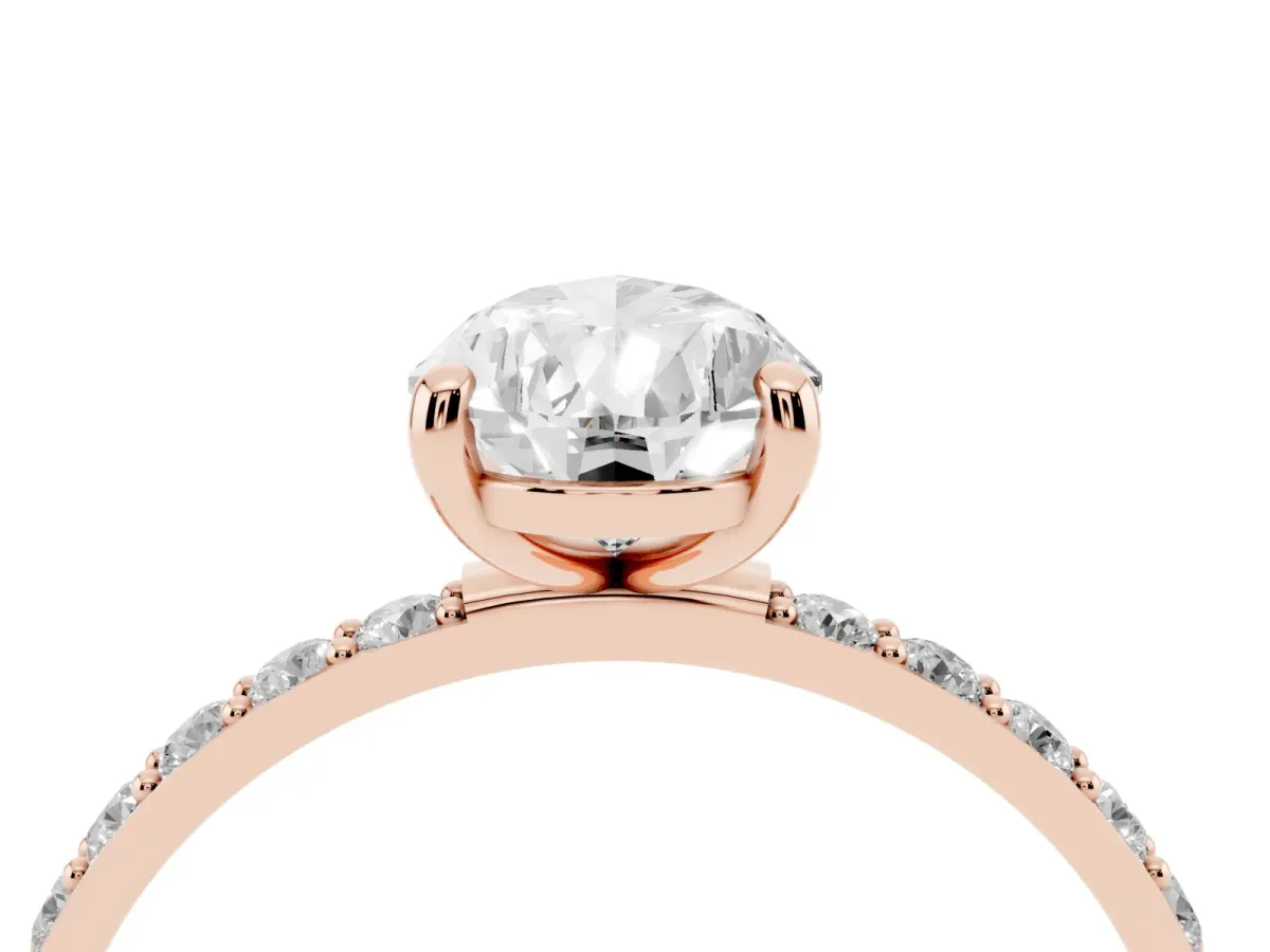 Pear Cut Diamond Solitaire Ring with Round Pavé Band and Prong Setting Rose gold