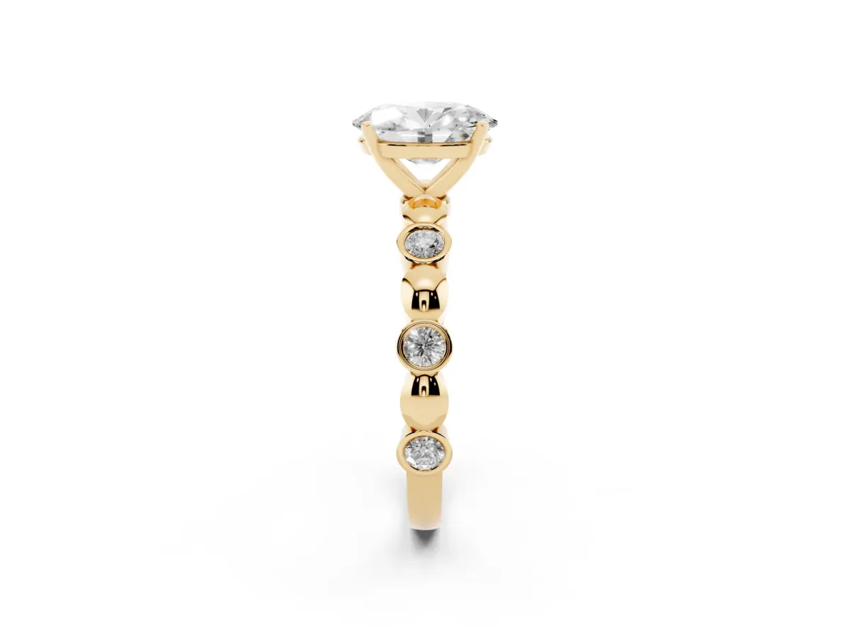 Oval Cut Solitaire Bezel-Set Diamond Ring with Beaded Band and Four-Prong Setting Yellow gold