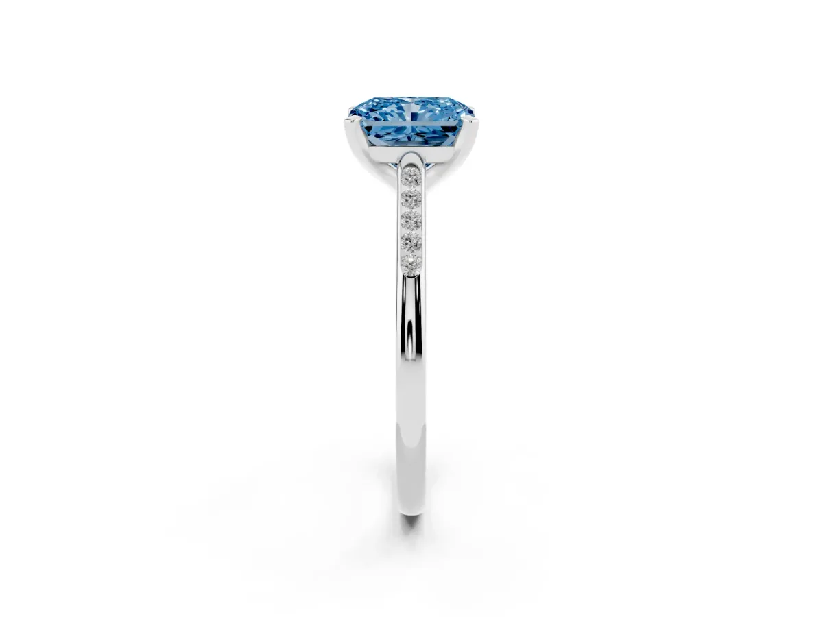 Fancy Blue Radiant Cut Diamond Solitaire Ring with Channel Set Round Band and Prong Setting Silver