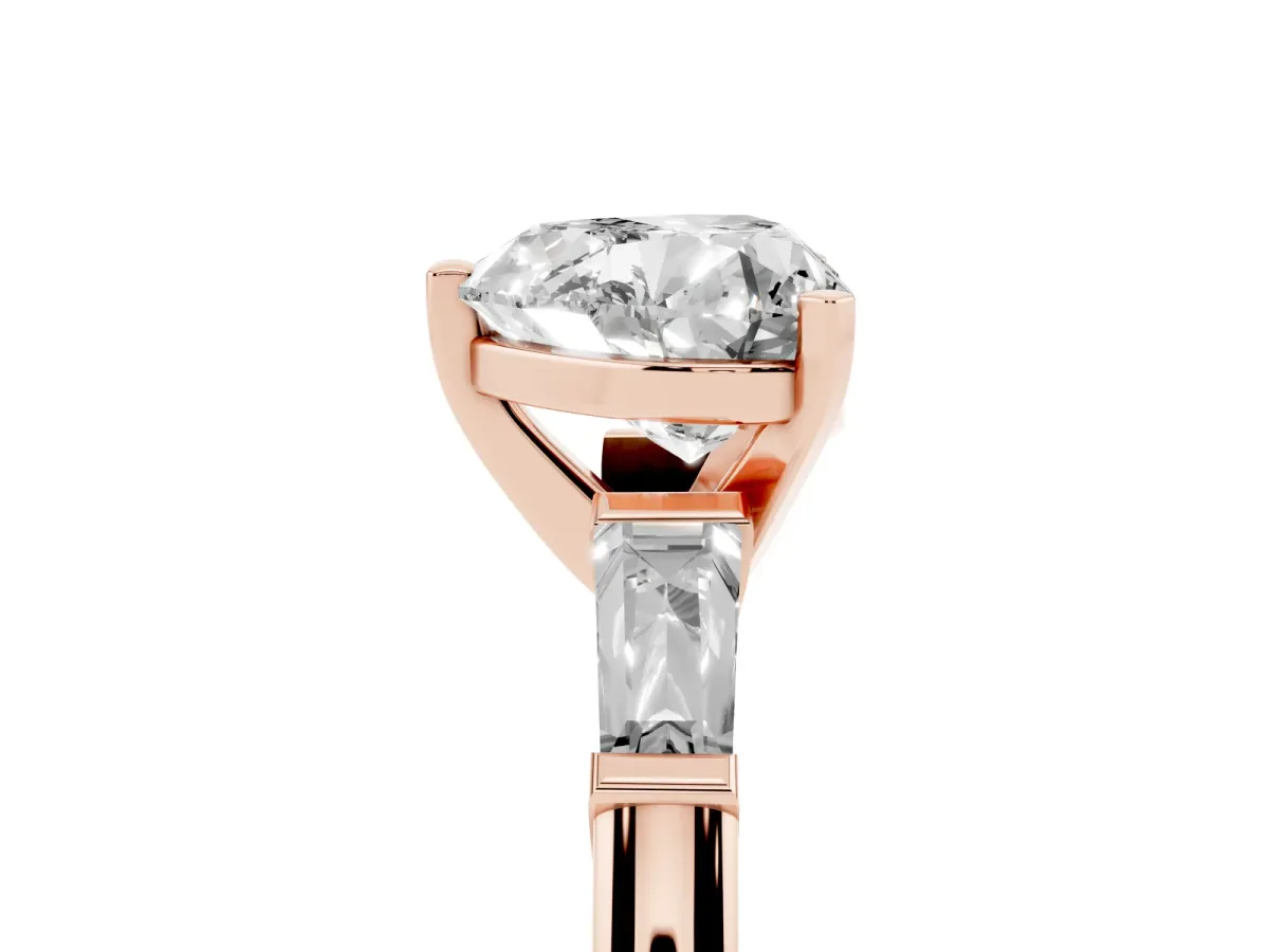 Heart Cut Solitaire with Tapered Baguette Side Stones on a Classic Band with Four-Prong Setting Rose gold