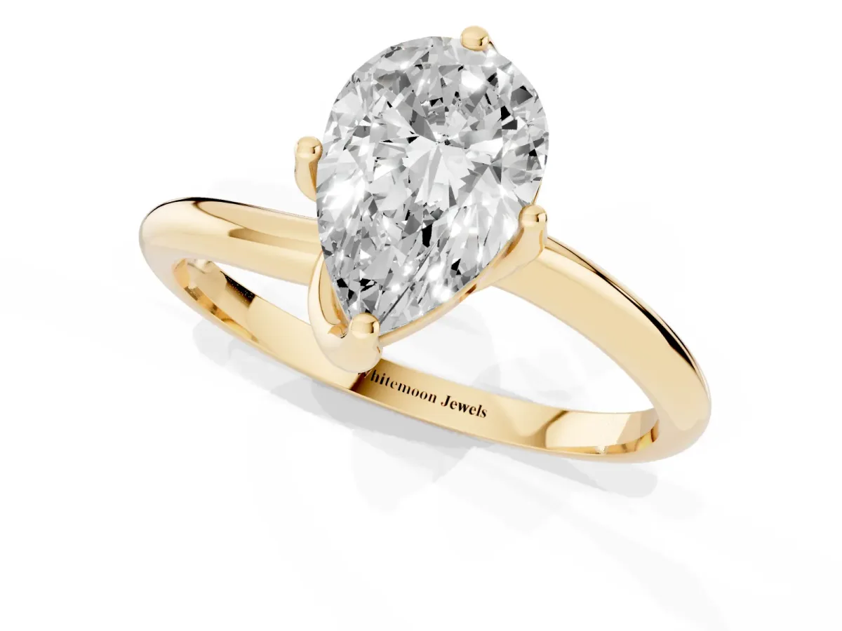 Pear Cut Diamond Solitaire Engagement Ring with Four-Prong Setting and Classic Band Yellow gold