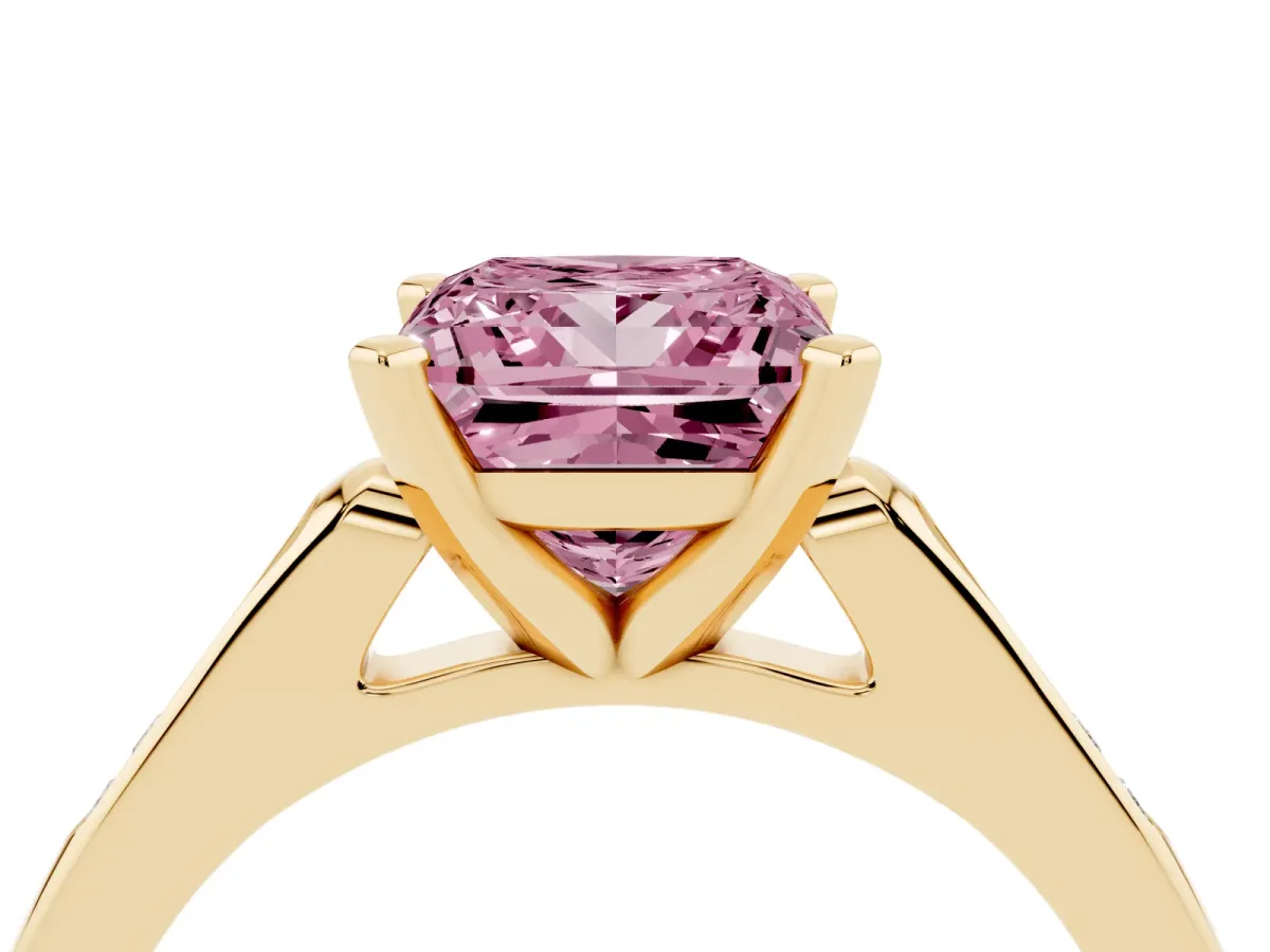 Fancy Pink Princess Cut Diamond Solitaire Ring with Channel Set Round Band and Prong Setting Yellow gold