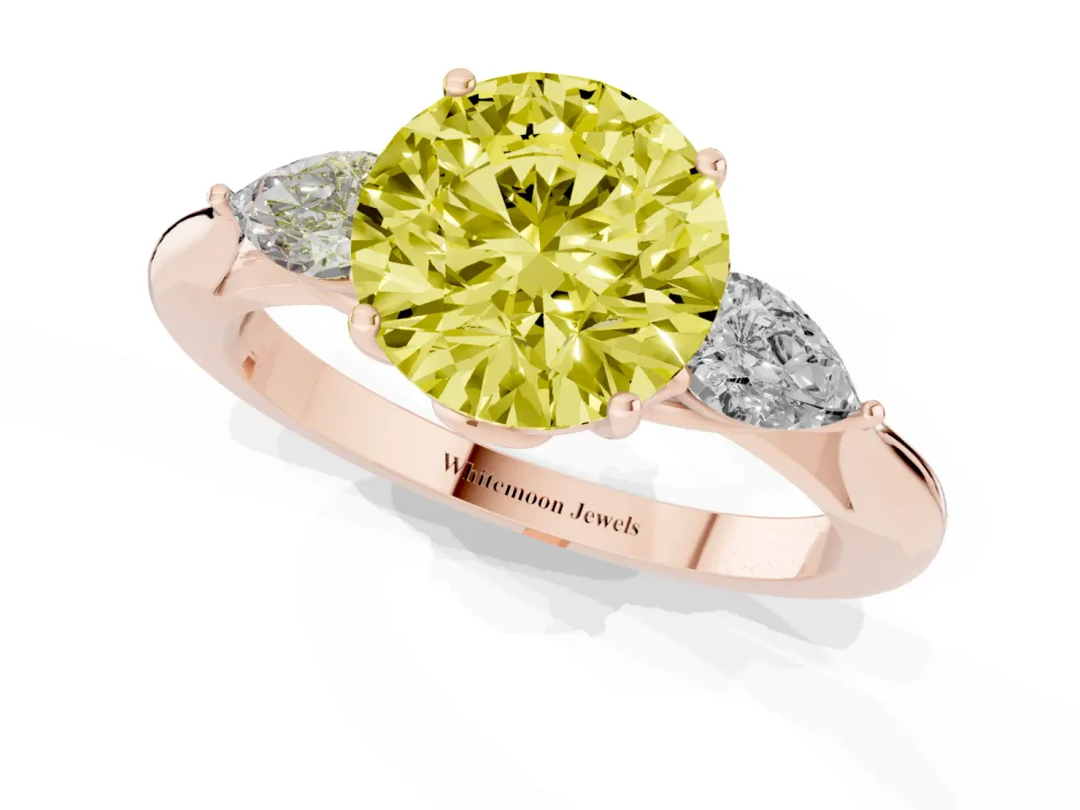 Fancy Yellow Three-Stone Round Cut Diamond Ring with Pear Side Stones in Four-Prong Setting Rose gold