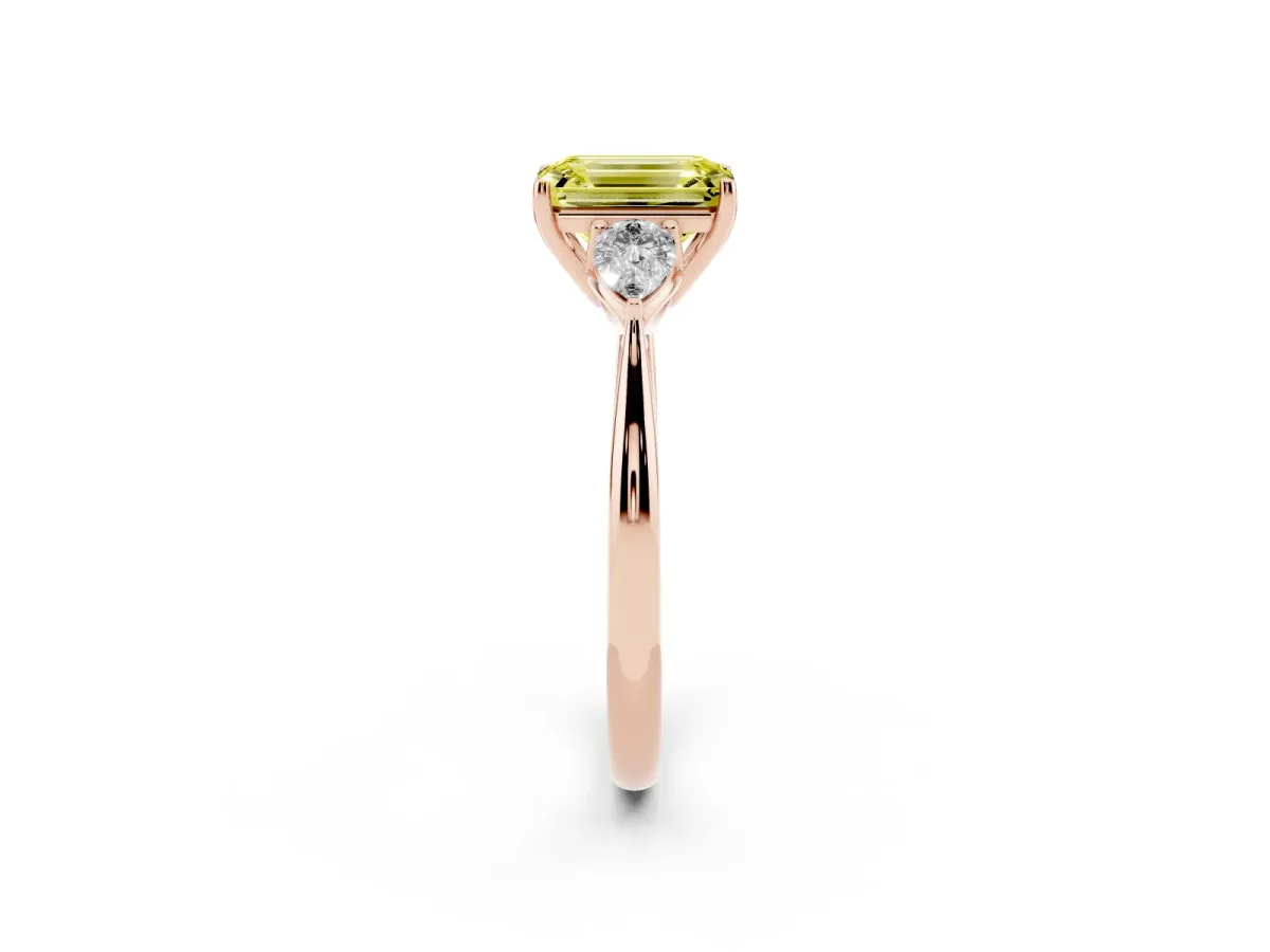 Fancy Yellow Three-Stone Emerald Cut Diamond Ring with Pear Side Stones in Four-Prong Setting Rose gold