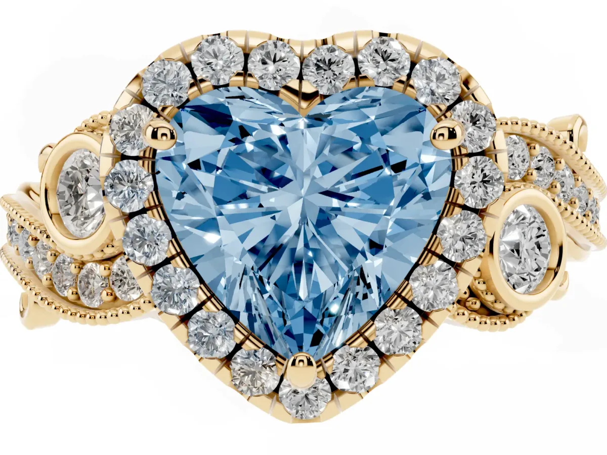 Fancy Blue Heart Cut Halo Diamond Ring with Milgrain and Bezel Accents on a Split Shank Band Yellow gold