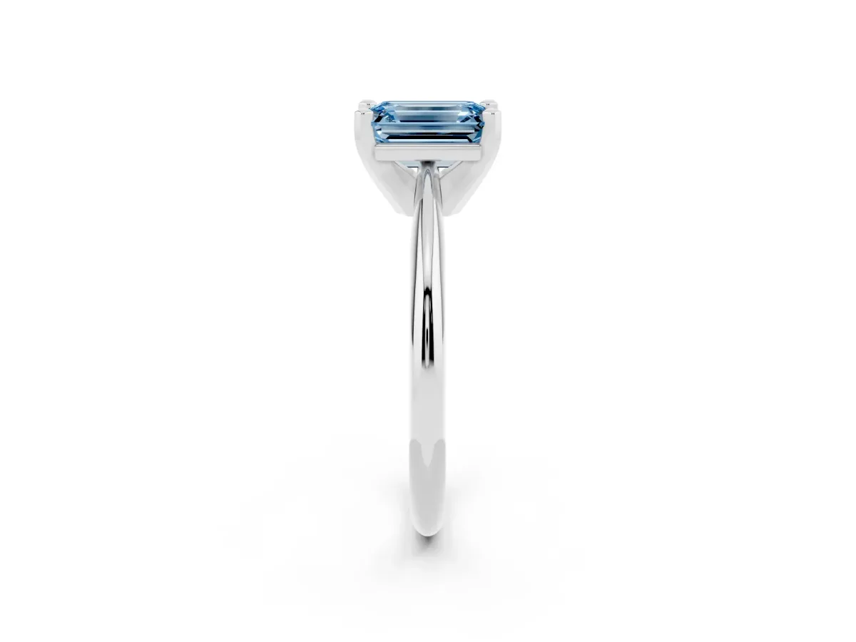 Fancy Blue Emerald Cut Cut Solitaire Ring with Four-Prong Setting on a Classic Band White gold