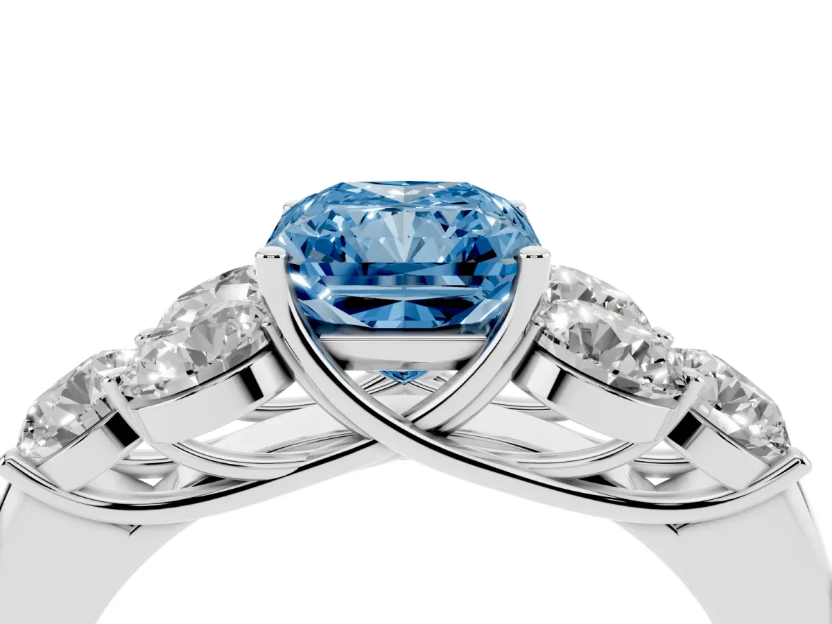 Fancy Blue Radiant Cut Cut Diamond Cluster Ring with Round Accent Stones and Prong Setting on a Classic Band White gold