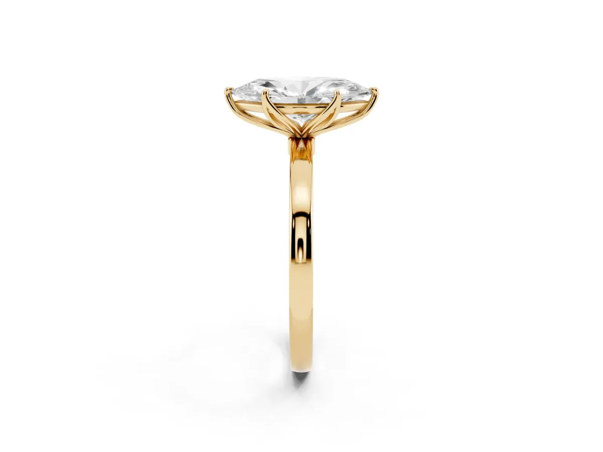 Marquise Cut Diamond Solitaire Ring with Thin Band and Prong Setting Yellow gold
