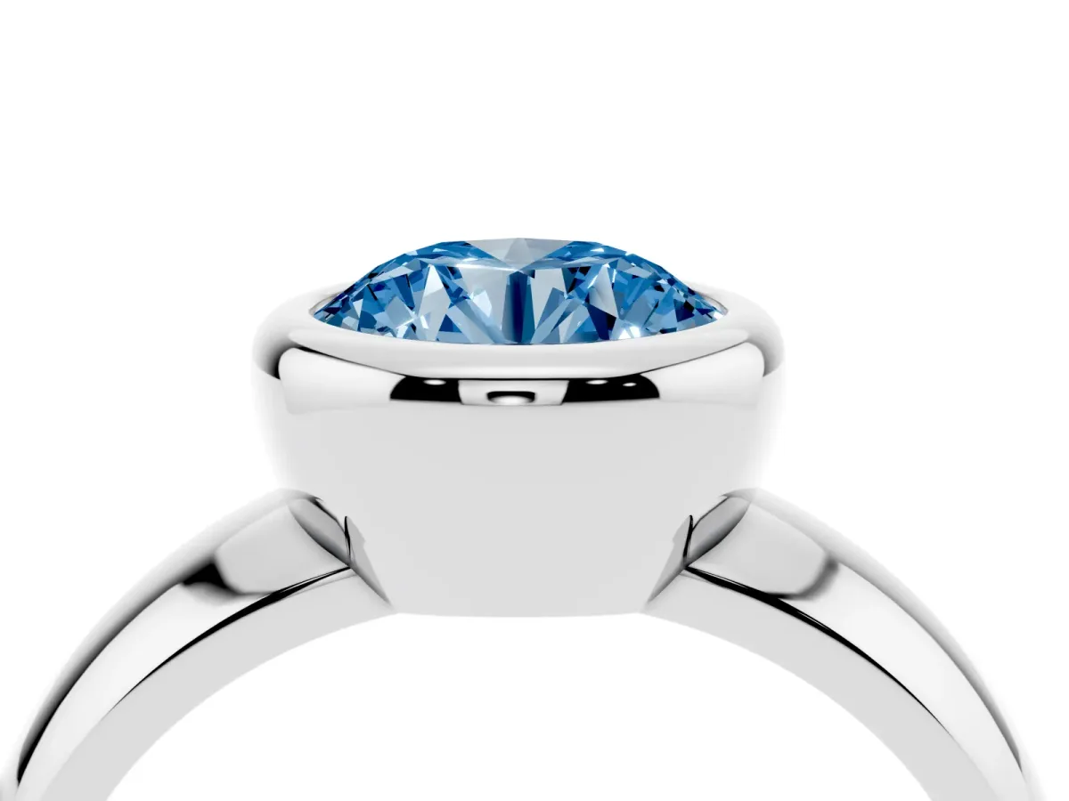 Fancy Blue Bezel Set Round Cut Solitaire Ring with Wide Band Platinum
