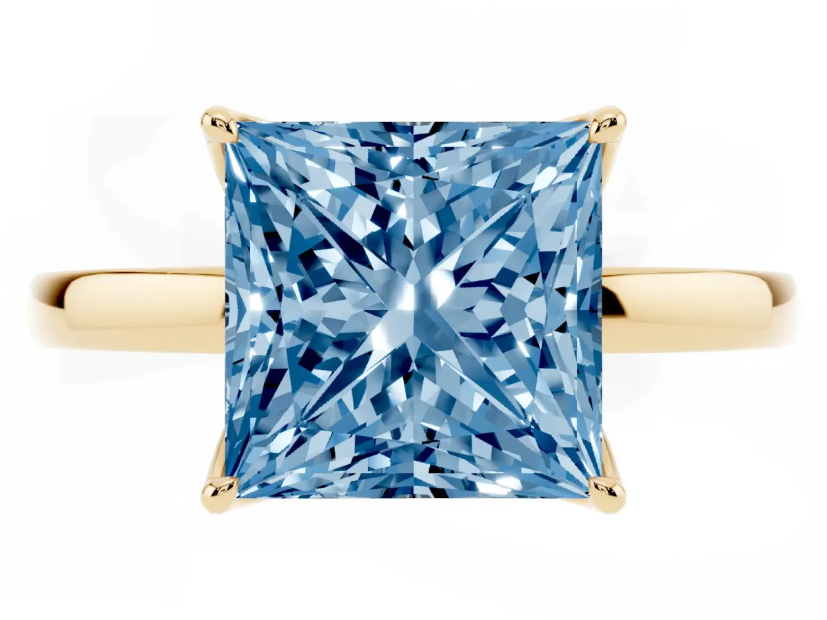 Fancy Blue Princess Cut Diamond Solitaire Ring with Thin Band and Prong Setting Yellow gold