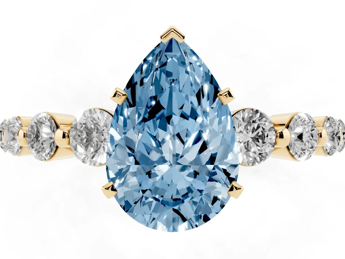 Fancy Blue Pear Cut Solitaire Diamond Ring with Pave Band and Four-Prong Setting Yellow gold