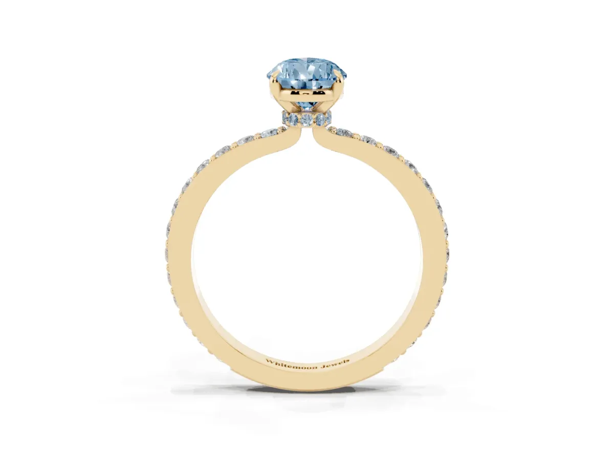 Fancy Blue Pear Cut Diamond Pavé Engagement Ring with Round Accents and Prong Setting Yellow gold
