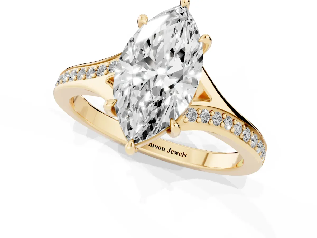 Marquise Cut Diamond Solitaire Ring with Pavé Band and Prong Setting Yellow gold