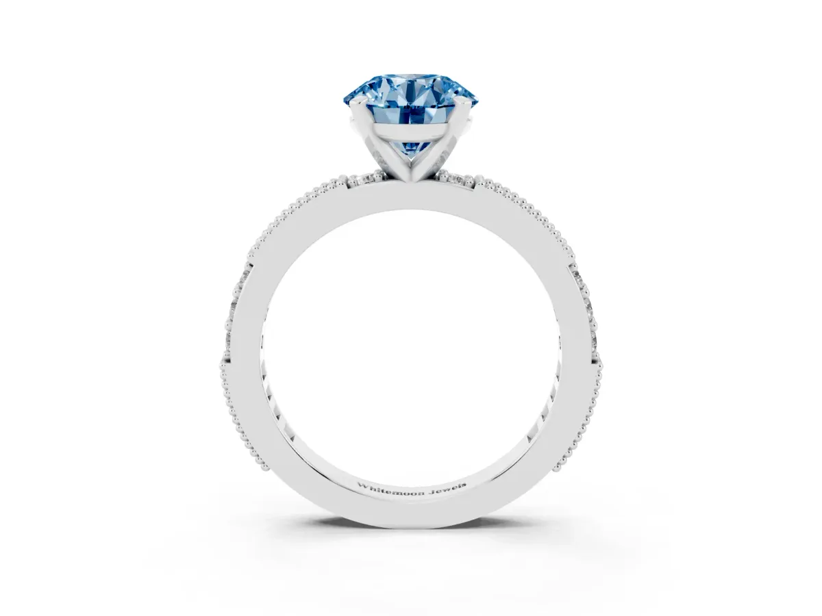 Fancy Blue Round Cut Solitaire with Pavé Band and Four-Prong Setting Platinum