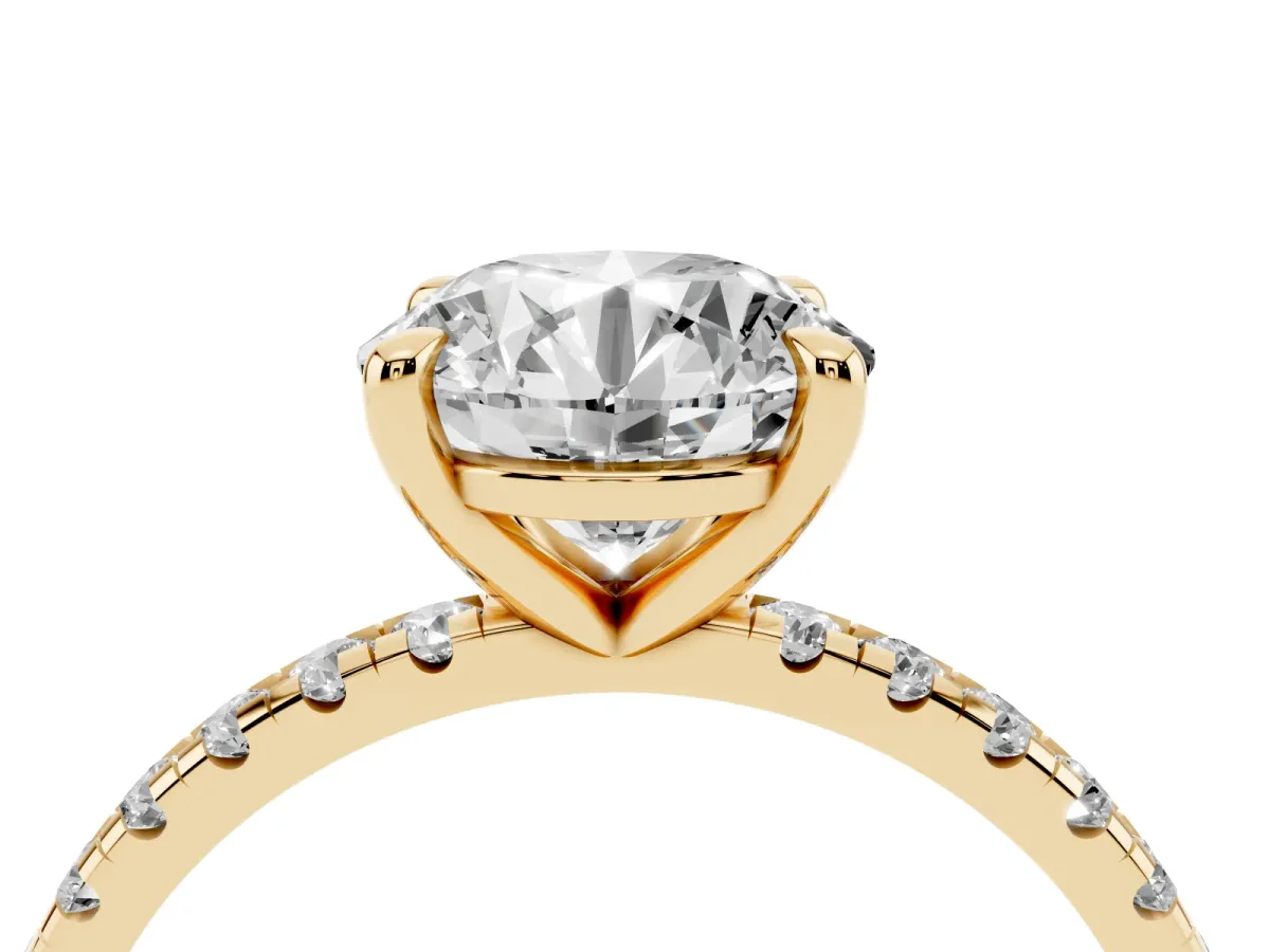 Round Cut Diamond Brilliant Solitaire Ring with Pavé Band and Four-Prong Setting Yellow gold