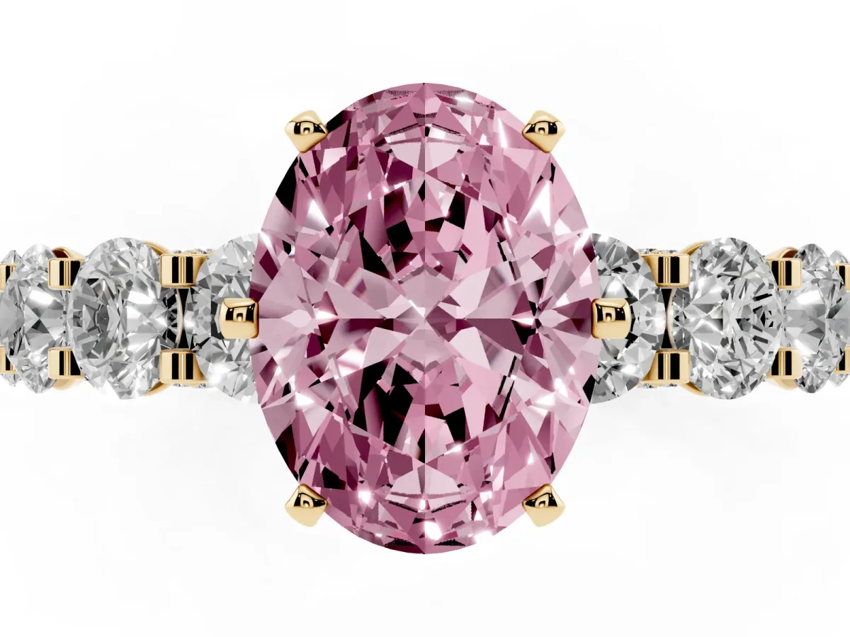 Fancy Pink Oval Cut Diamond Side Stone Engagement Ring with Four-Prong Setting Yellow gold